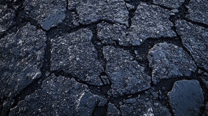 Obraz premium Detail of asphalt road paving captured from heavy machinery, emphasizing the intricate asphalt textures and patterns, with ample copy space for design elements.