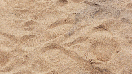 The sand spreads out on the wide beach