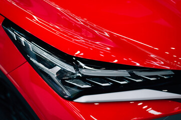 headlight of a new red car