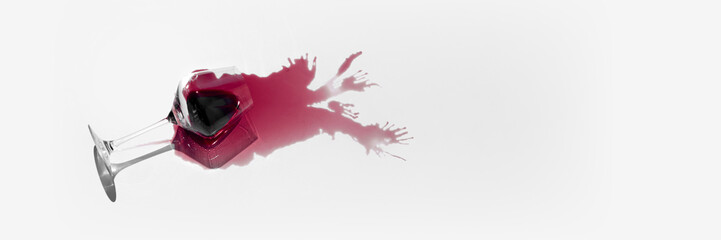 Spilled glass of red wine mockup with intricate reflections and unique splash pattern, offering...