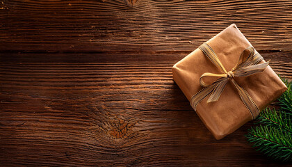 Fototapeta premium Brown Christmas gift box on rustic wooden table