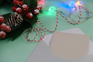 Season's greetings scene. Top view of Christmas decorations, balls, rustic star, holly berries,...