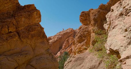Mountains in Sahara desert in a hot sunny day. Chebika oasis in Tozeur Governorate panoramic...
