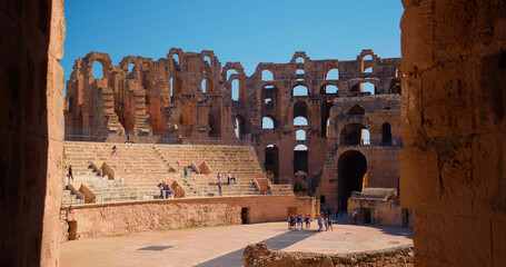Antique amphitheater Gordian historic excursion in Tunisia Africa. Tourists walking in old...