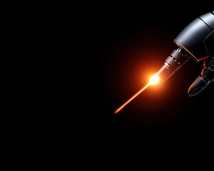 Fototapeta premium A robotic arm emits a bright orange beam against a dark background, showcasing advanced technology and precision in action.