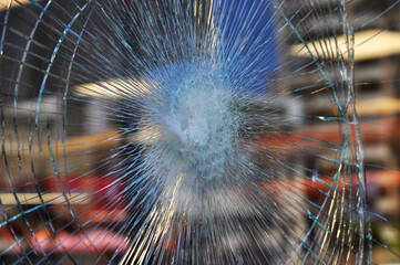 Reflection on stained glass window broken by attempted robbery