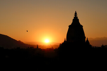 The silhouette, contour of the Shilu, Silu Mahadeva, Mahadev Temple and the skyline of the old town of Bhaktapur at sunset, Bhaktapur, Nepal