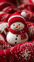 Fototapeta premium Cute snowman in red knitted hat and scarf.