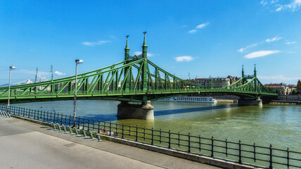 Fototapeta premium Freedom Bridge crosses the Danube River connecting the two banks Buda and Pest in the Hungarian capital Budapest