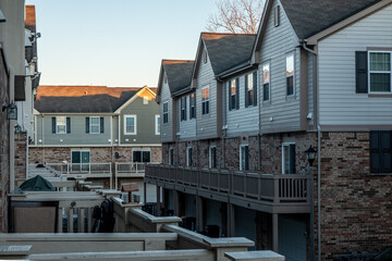 Two story low income retirement homes with the garage in the front
