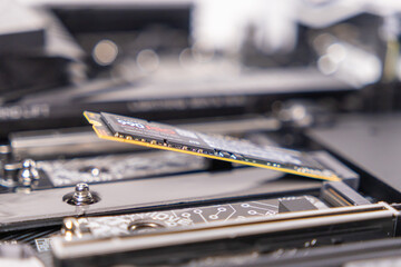 installing m.2 nvme ssd, motherboard slot, close-up, high-speed storage, upgrading pc, hardware...