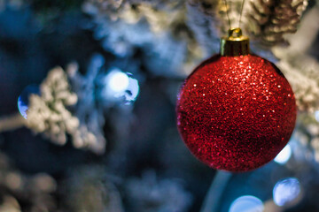 Red Glitter Christmas Ornament on Artificial Tree