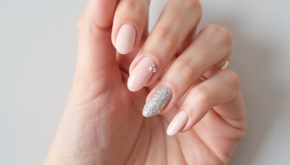 Fototapeta premium Minimalist manicure with soft pink and glitter design
