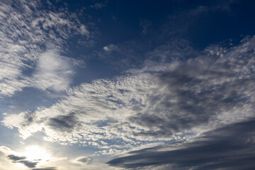 Obraz premium Dark blue sky with white moody clouds