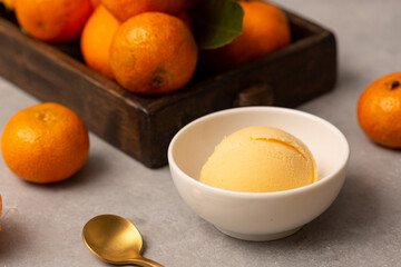 A ball of natural tangerine ice cream