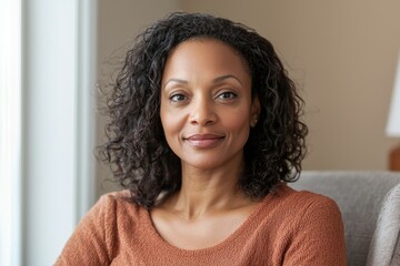 Confident african female adult with curly hair in casual attire