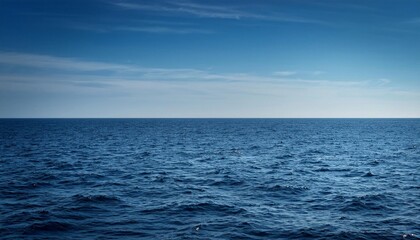 Obraz premium Calm blue ocean meeting the horizon under a clear sky