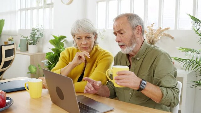 Mature couple having issues using laptop