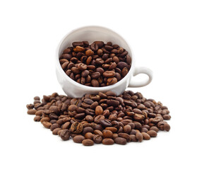Coffee beans spilling out of a cup.