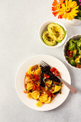 A nutritious and delicious breakfast plate featuring black rice with stewed vegetables, fresh...