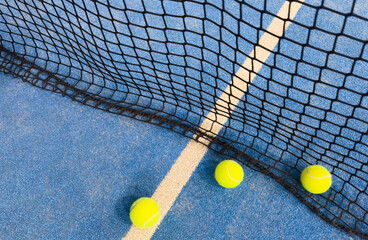 Paddle tennis ball on the court for background.