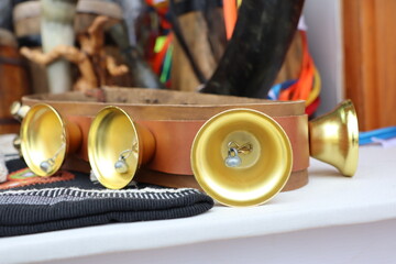 Beautiful Golden Decorative Bells Artfully Arranged on a Wooden Base for Your Home