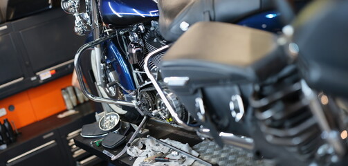 Motorcycle and parts in the garage kitchen, close-up. Pedal replacement, transmission tuning,...