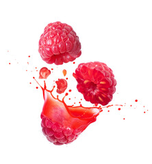 Whole and sliced raspberries with flowing juice close-up isolated on white background