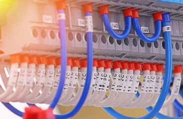 Connection of electrical modules using insulated mounting wires. Close-up. Soft focus.