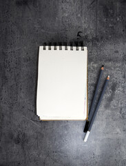 Notebook mockup on a black background, free space for your design and home interior, mock up