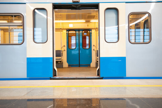 Empty subway train with opened doors at metro station
