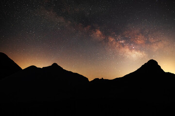 Beautiful night landscape, Bright Milky Way galaxy over the mountains, starry sky.