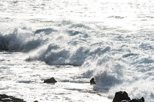 North coast of Tenerife, Canary Islands, waves breaking against dark lava rocks.