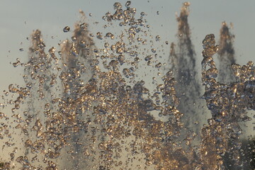 fontain jets at the park at sunset