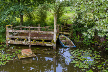 Aerial drone view of a little Lake looks like from tom sawyer & huckleberry finn Boat mooring with...