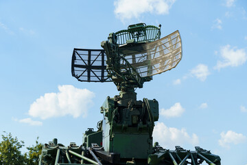 Military radar system operates under a clear blue sky at the testing site