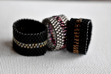 Handmade beaded rings isolated on a white surface 