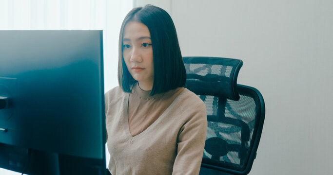 Young adult Asia female freelance typing write prompt AI bot IT app smart program nomad, video game, terminal with coding language, user interface, designer, big data center on desktop computer.
