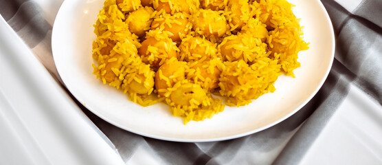 Traditional Brazilian dish chicken with pequi (caryocar brasiliense) and rice