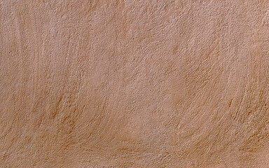 Arabic clay sand wall texture. Old arabic house brown wall plaster textured pattern background.