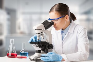 Sientist research with microscope at laboratory for medical study