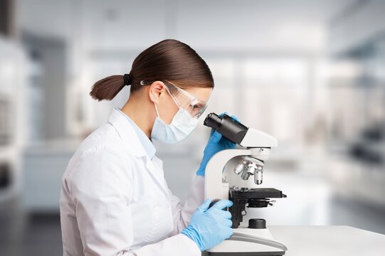 Sientist research with microscope at laboratory for medical study