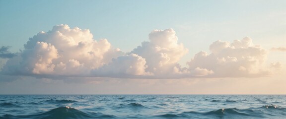 Obraz premium Serene Ocean Waves with Fluffy Clouds Against Pastel Sky with Copy Space