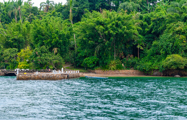 Lagoon with pier and boat in Angra dos Reis, Rio de Janeiro, Brazil. Tropical seascape of Brazil.