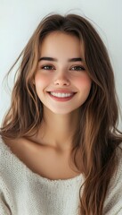 Naklejka premium Portrait of a beautiful young woman smiling and looking on white background