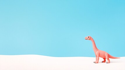 Plastic Pink Dinosaur Toy Against Blue Background