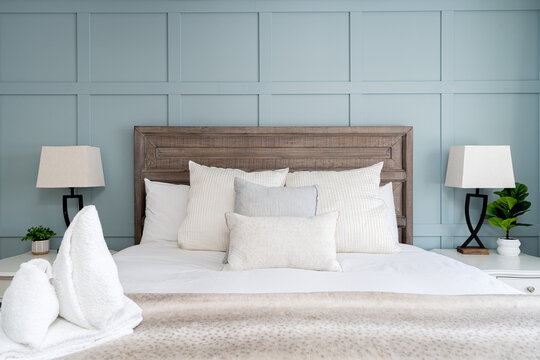 Cozy modern master bedroom with accent wall of a rental property.
