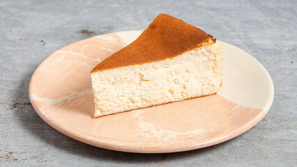 San Sebastian cheesecake piece on plate