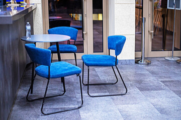 cafe with round tables and blue chairs