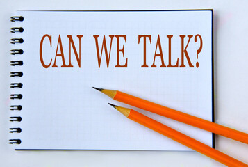 CAN WE TALK? - words in notebook on white background with pencils